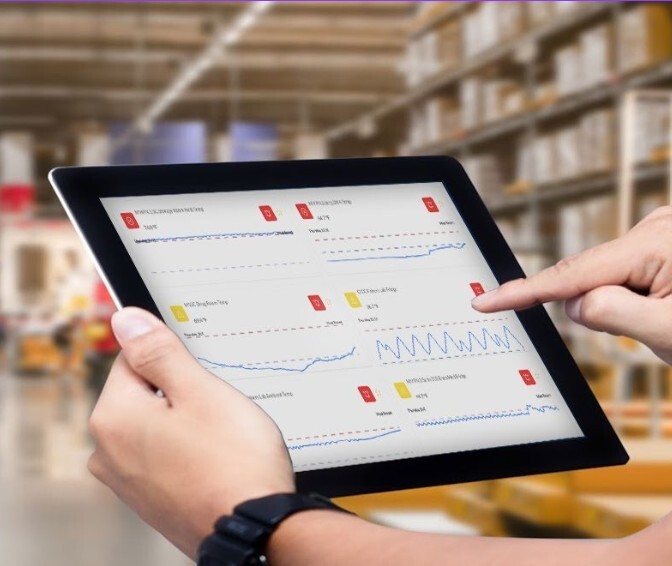 Team Member Reviews Sonicu Reports on a Tablet